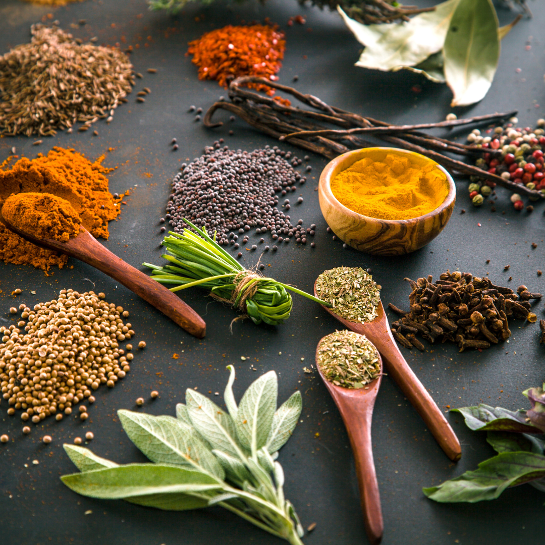 A vibrant display of various Indian spices, showcasing their rich colors and textures.