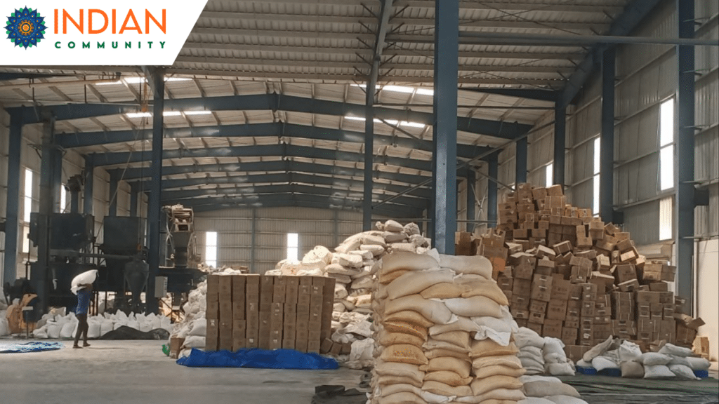 a warehouse or industrial space with stacks of bags and boxes, related to food or waste management.