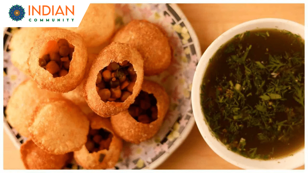 Homemade crispy Sooji Ke Gol Gappe served with spicy pani and chutney on a plate.