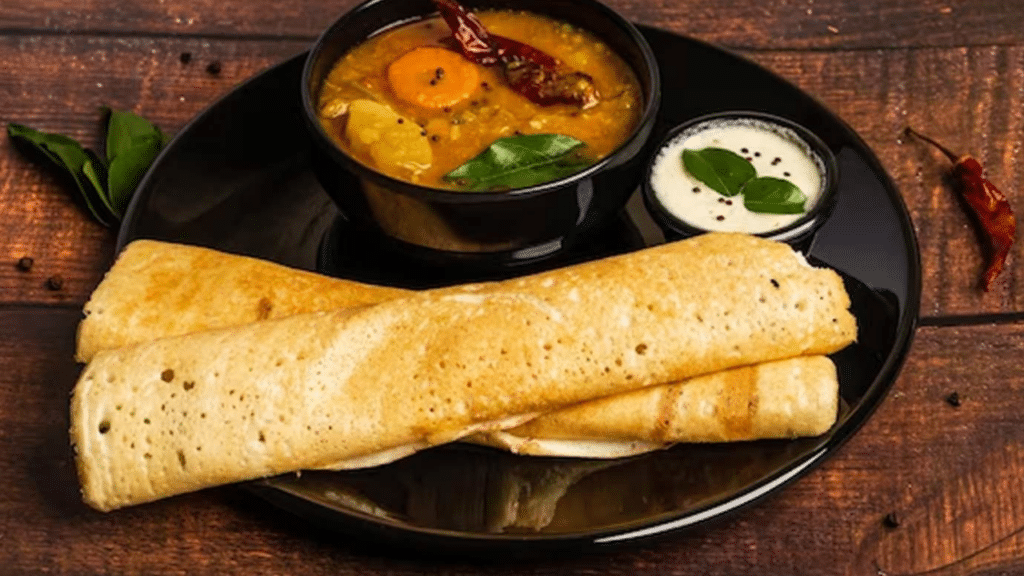 Crispy Kala Chana Dosa served in a platter.