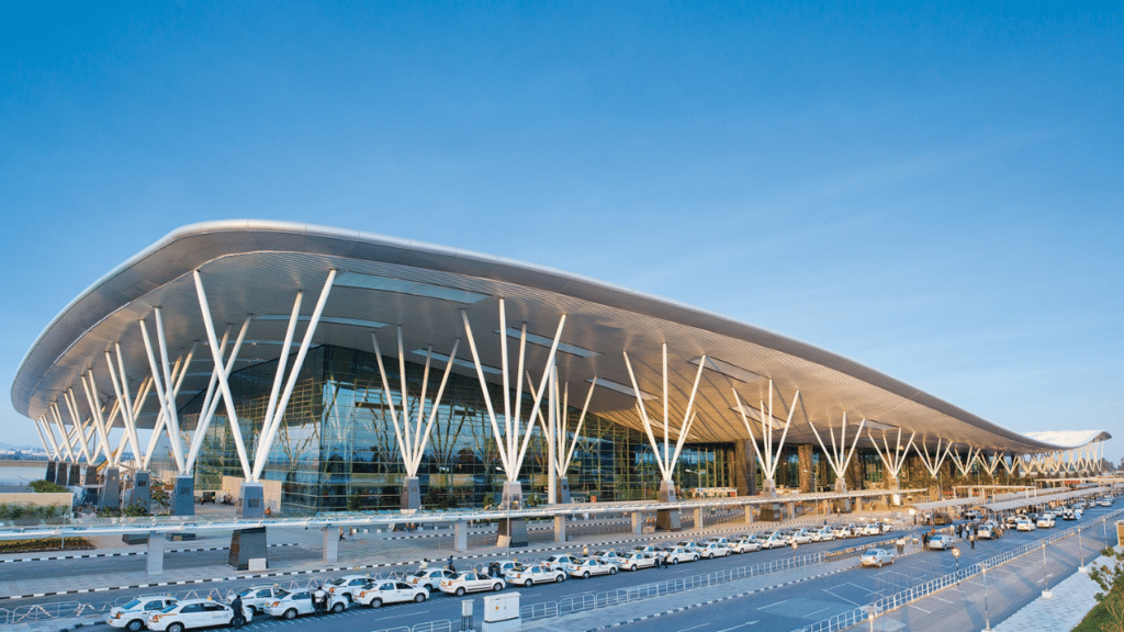 Aerial view of Bengaluru Airport runways with planes on the tarmac, highlighting the upcoming closures during Aero India Show 2025.