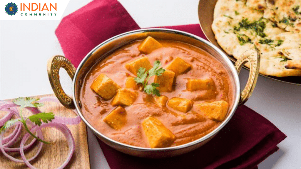 Shahi Paneer served in a bowl with a creamy, aromatic gravy, garnished with fresh herbs and nuts