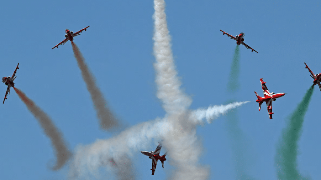 The Indian Air Force (IAF) Surya Kiran aerobatics team performs during Aero India 2025