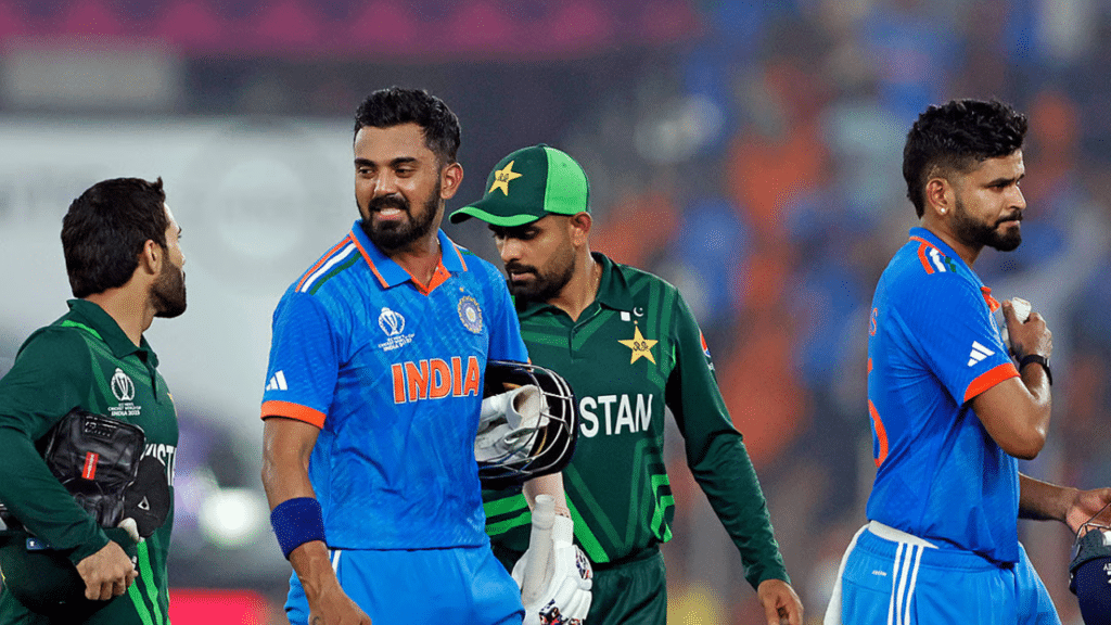 India's KL Rahul interacts with Pakistan's Mohammad Rizwan as Shreyas Iyer and Babar Azam walk back to the pavilion