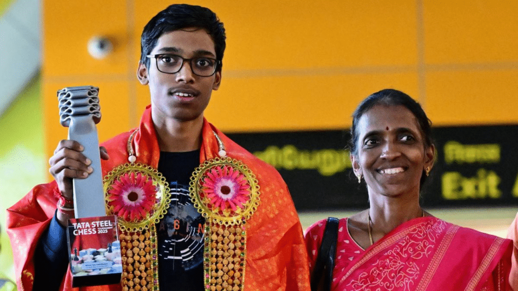 Praggnanandhaa with his mother on arrival at the Chennai International Airport.