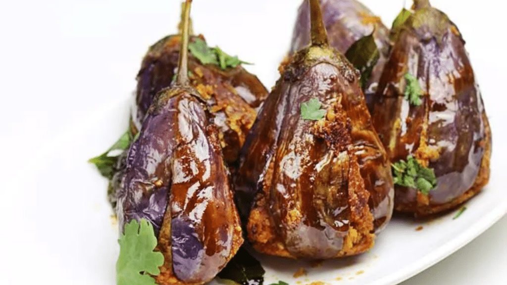 Stuffed Brinjal Fry (Gutti Vanakaya Fry) served on a plate with rice.