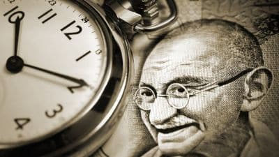Mahatma Gandhi and a watch showing time as 10:10