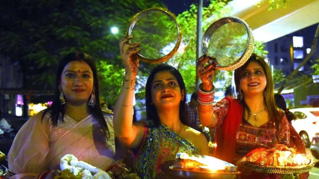 Karwa Chauth : Date, Puja Muhurat, Vrat Katha, Aarti, Mehendi Designs & Complete Puja Rituals 11 married women celebrating karwa chauth